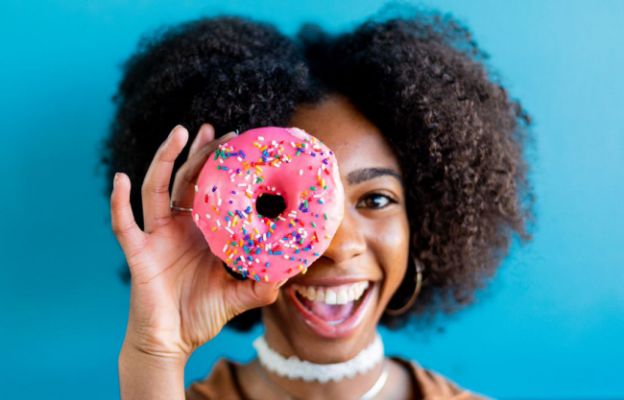summer intern eating hurts donuts in wichita, kansas